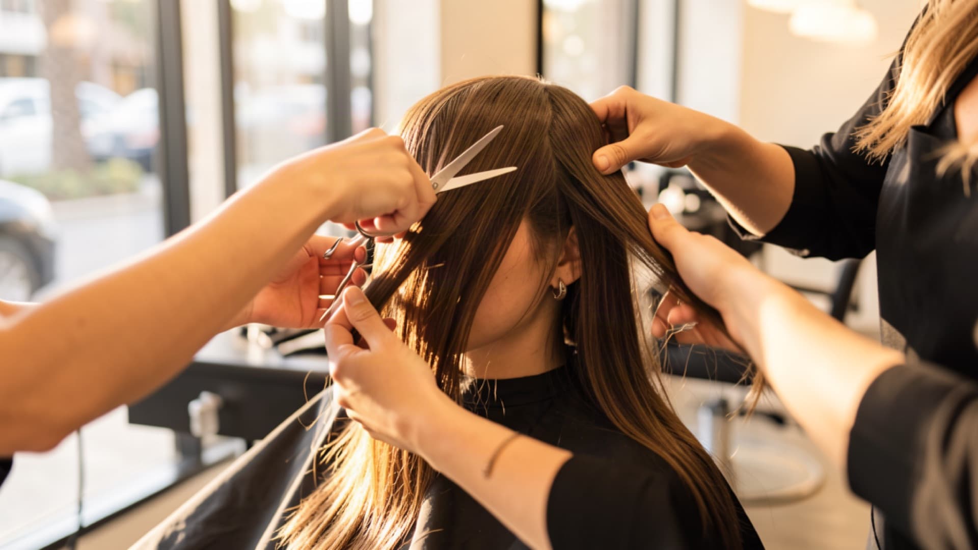 Woman getting a haircut in a Los Angeles salon